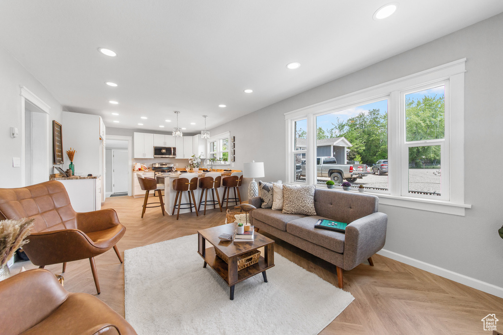 Living area featuring recessed lighting and baseboards