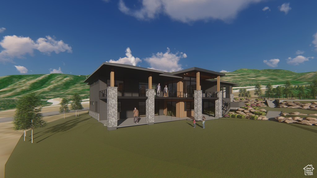 Rear view of property featuring a putting green, a mountain view, stone siding, and a balcony