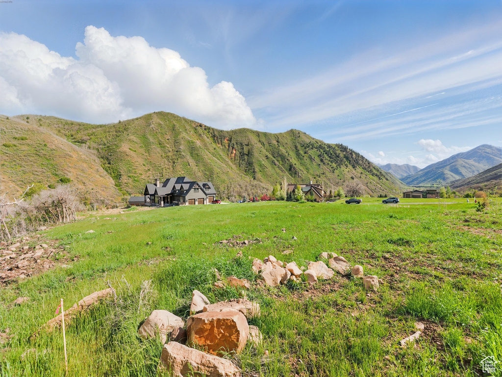 View of mountain backdrop featuring rural landscape
