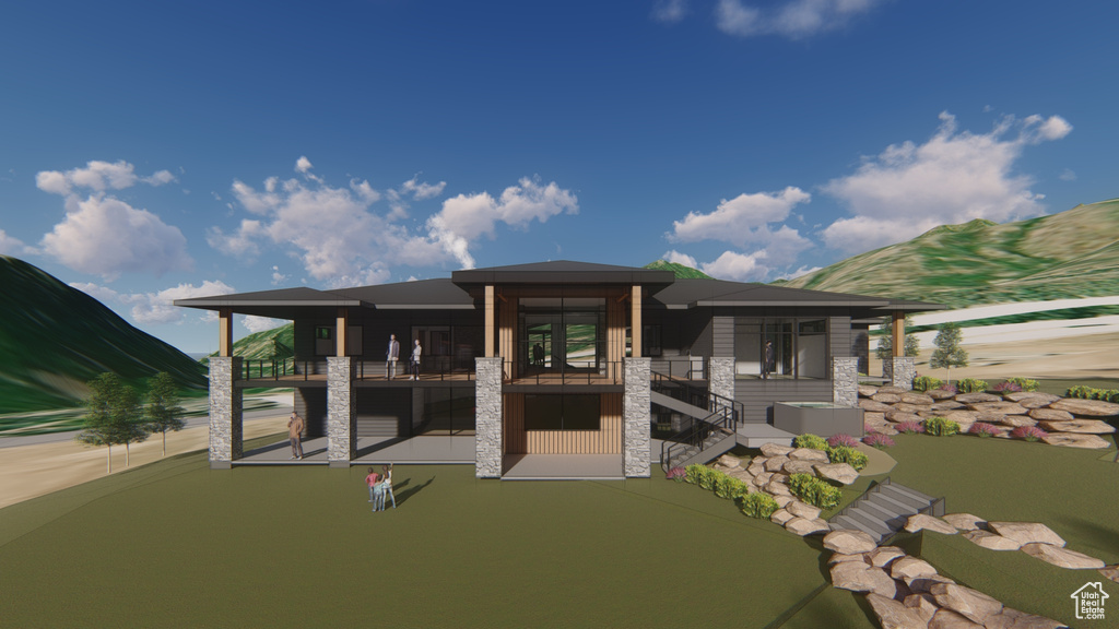 Back of house featuring stone siding, stairs, and a balcony