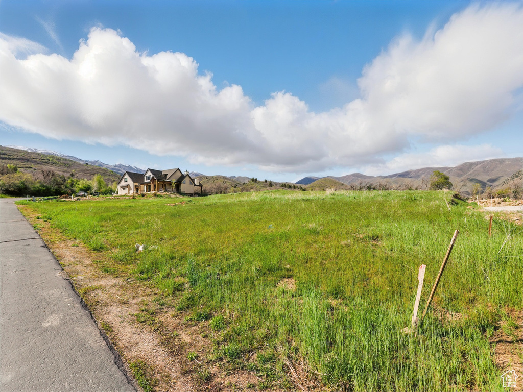 View of yard with a mountain view and a view of countryside