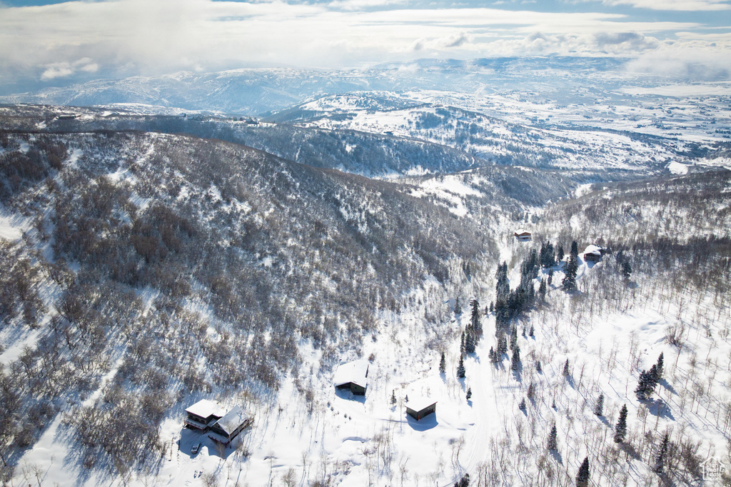 Snowy aerial view with a mountain view