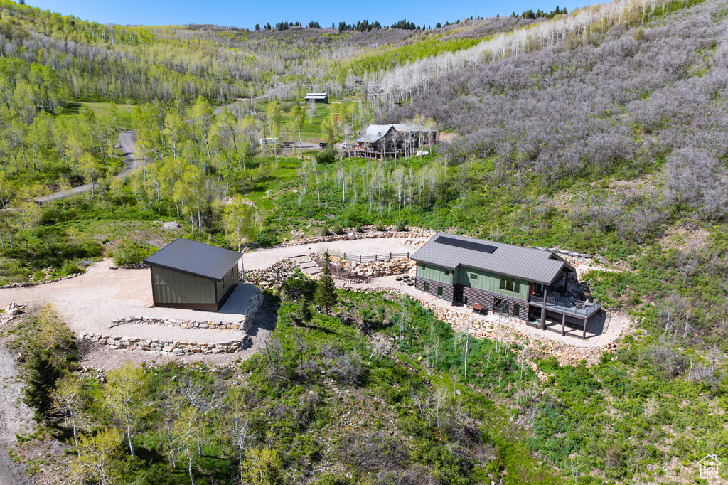 View of subject property featuring a heavily wooded area