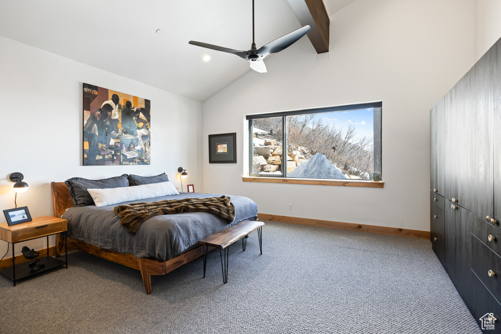 Bedroom with carpet floors, baseboards, beam ceiling, a ceiling fan, and high vaulted ceiling