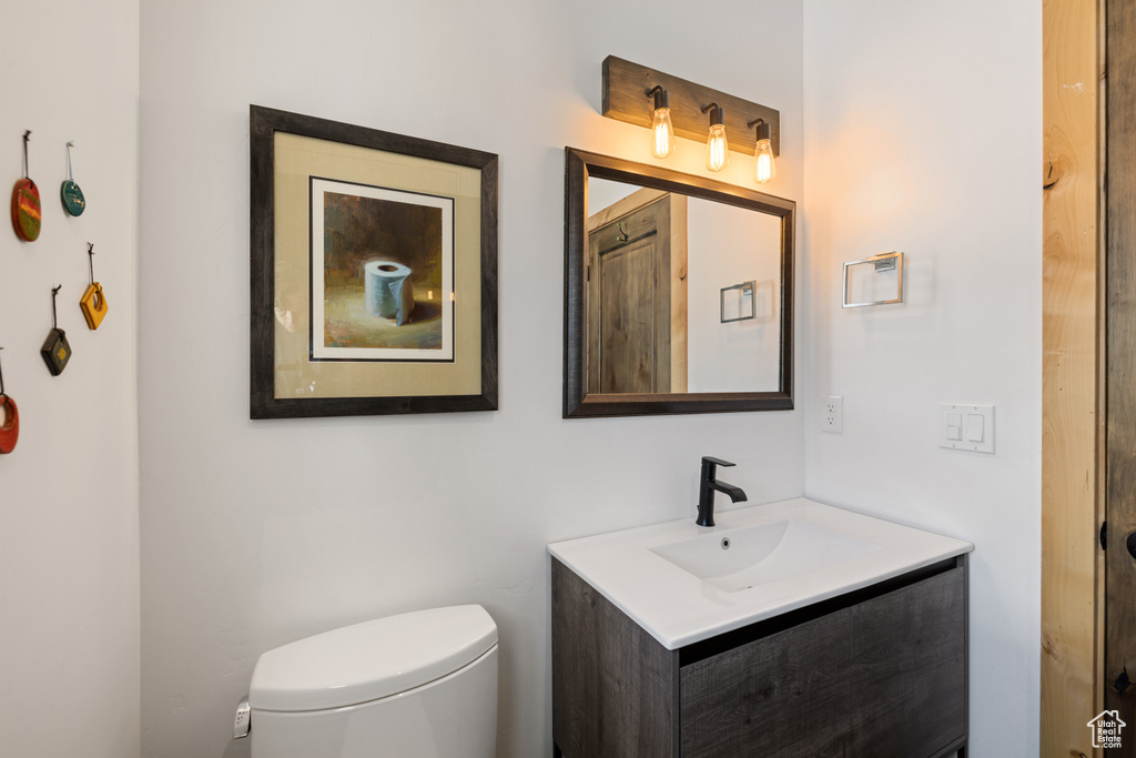 Half bath with toilet and vanity
