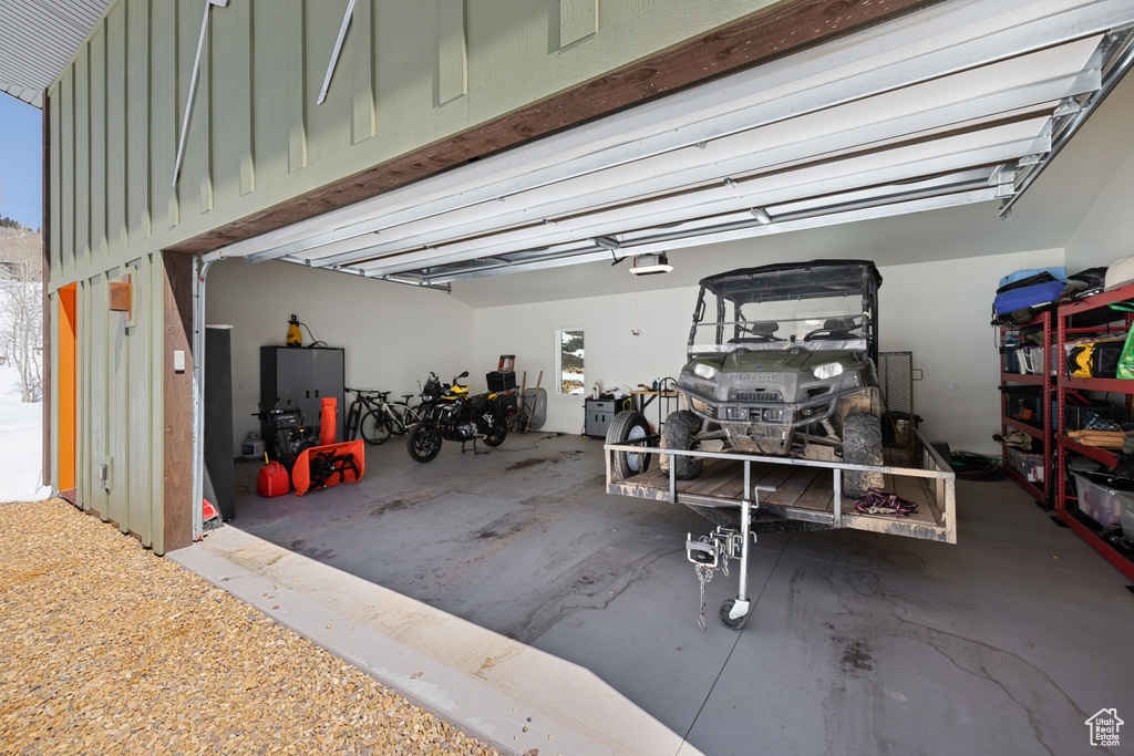 Garage featuring a garage door opener