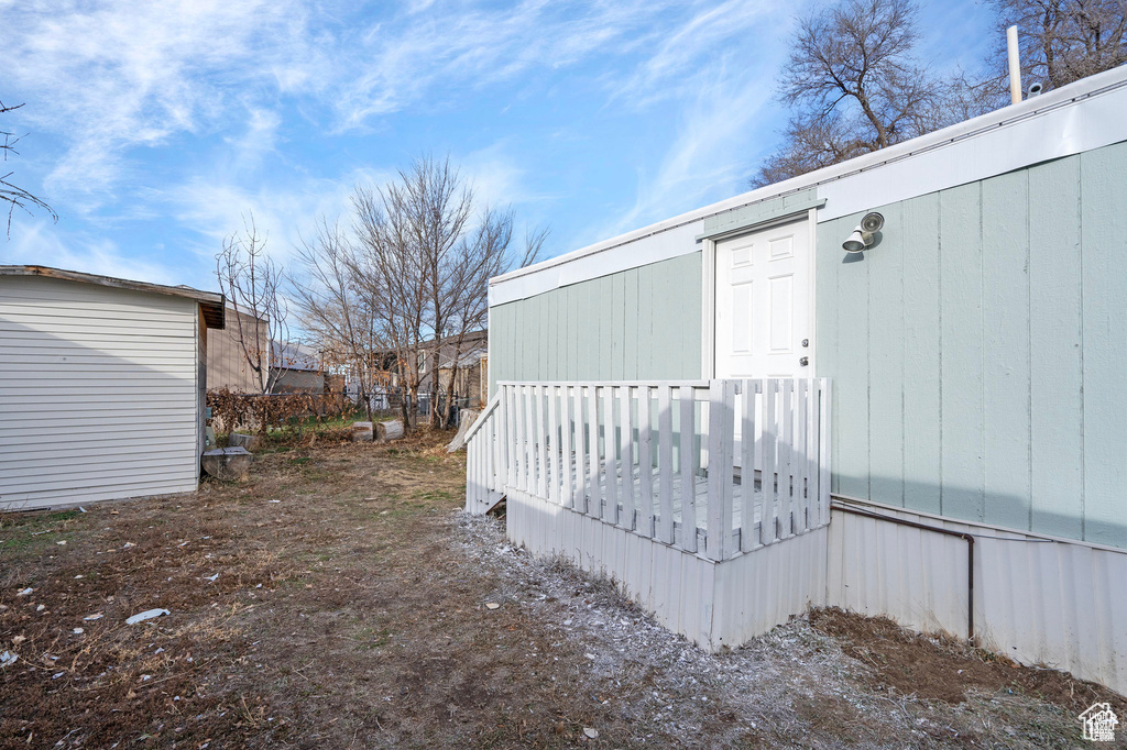 View of exterior entry featuring a deck