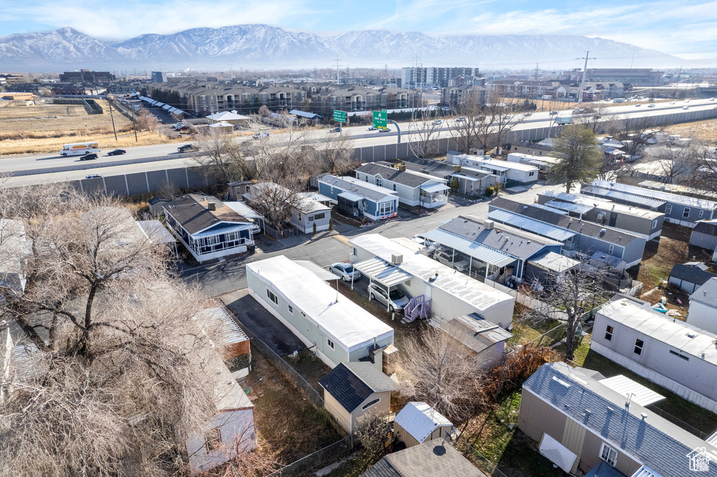 Aerial view of a mountain backdrop and industrial structures
