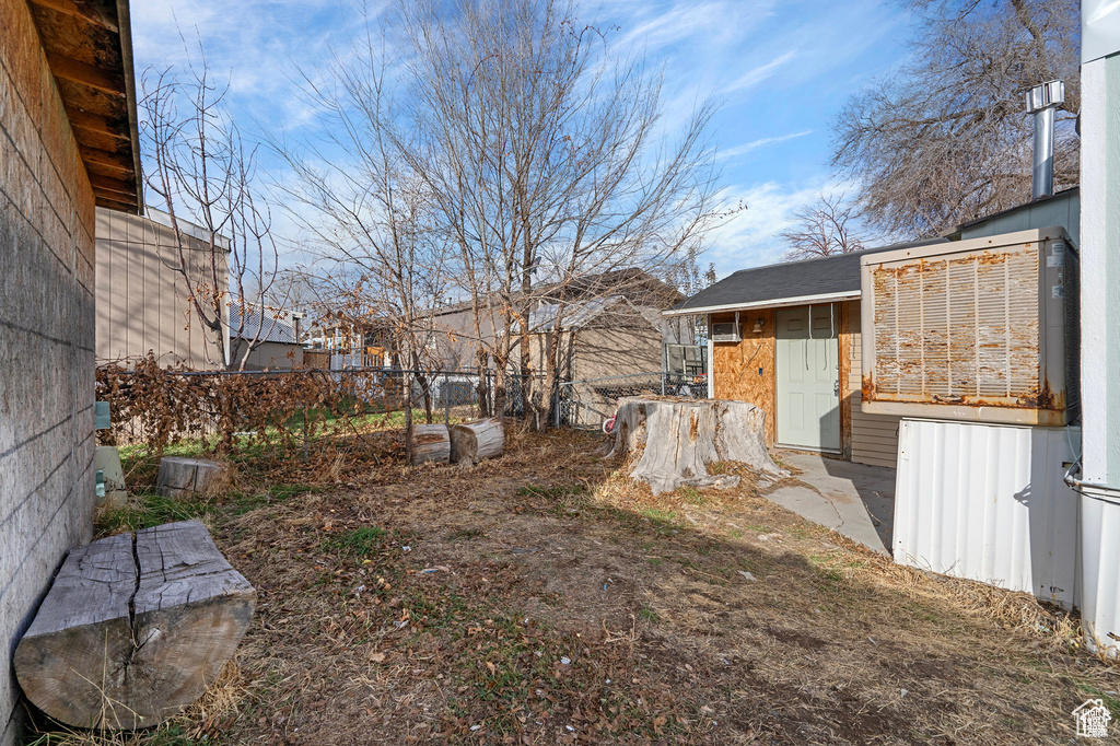 View of yard featuring fence