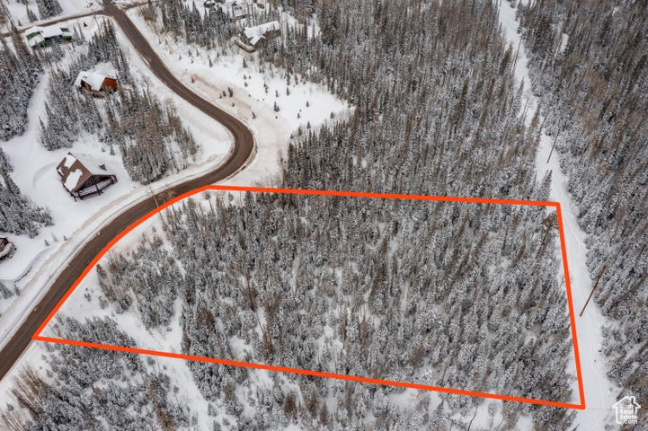 Snowy aerial view with property parcel outlined