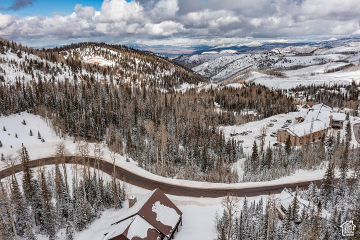 Snowy aerial view featuring a mountain view