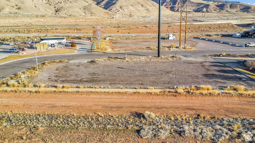 View of asphalt street featuring a mountain view