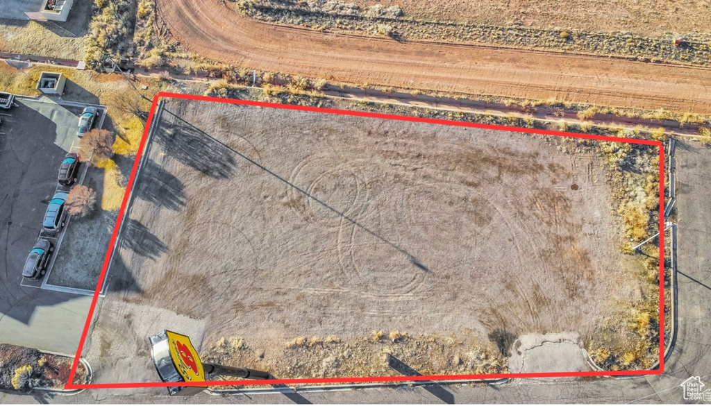 Aerial view of property and surrounding area with property boundaries highlighted