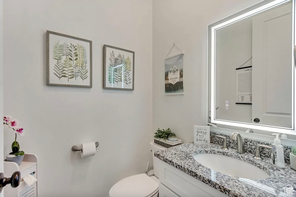 Bathroom featuring toilet and vanity