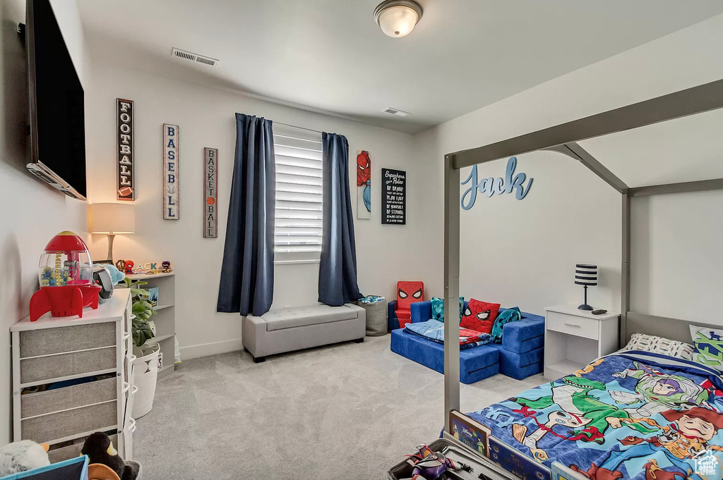 Carpeted bedroom with baseboards