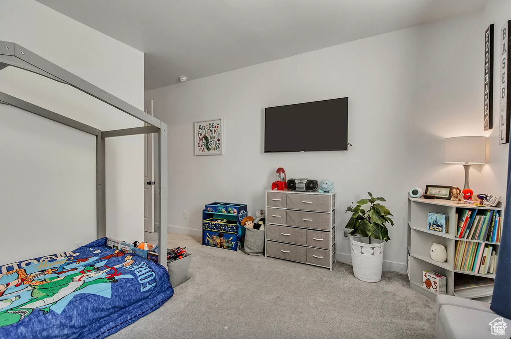 Bedroom with carpet floors and baseboards