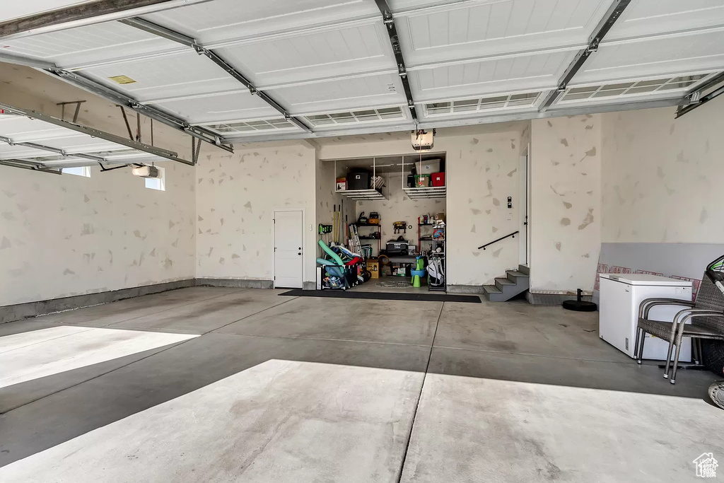 Garage featuring a garage door opener