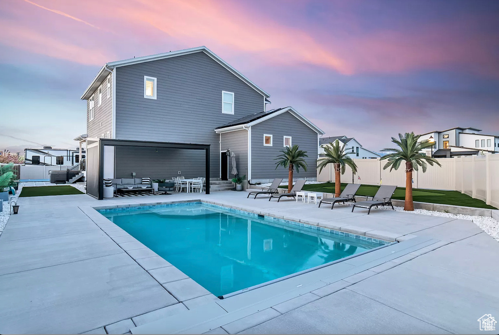 View of swimming pool with a patio, a fenced backyard, and entry steps