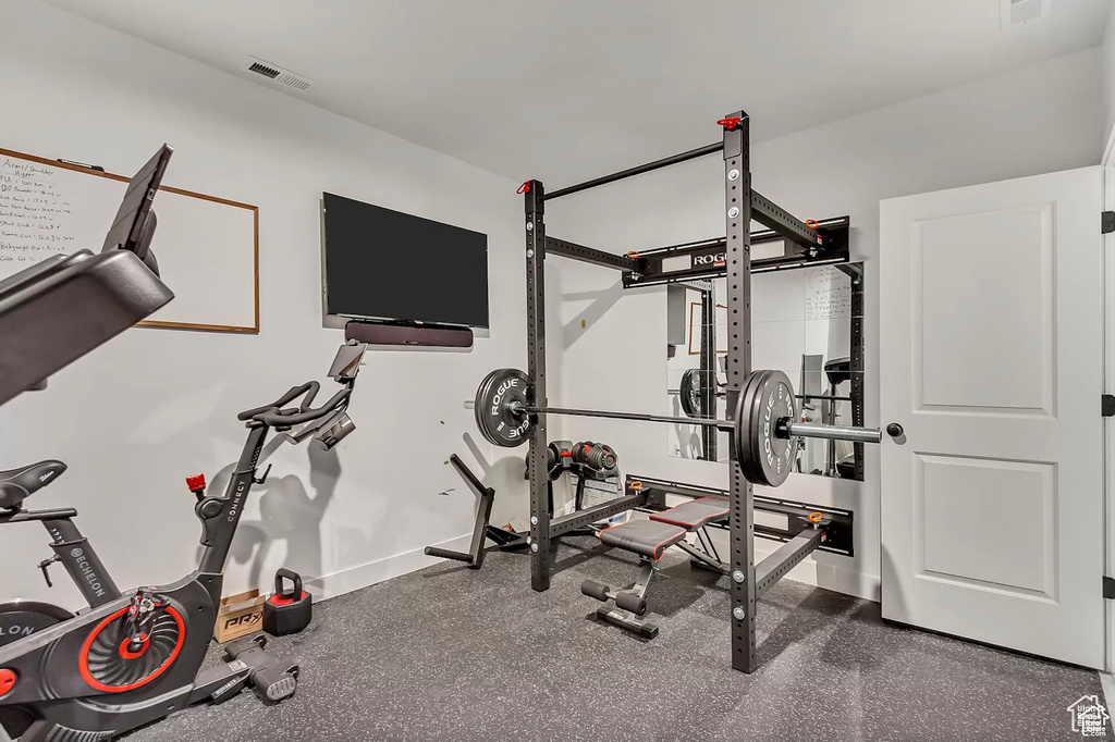 Exercise room featuring baseboards