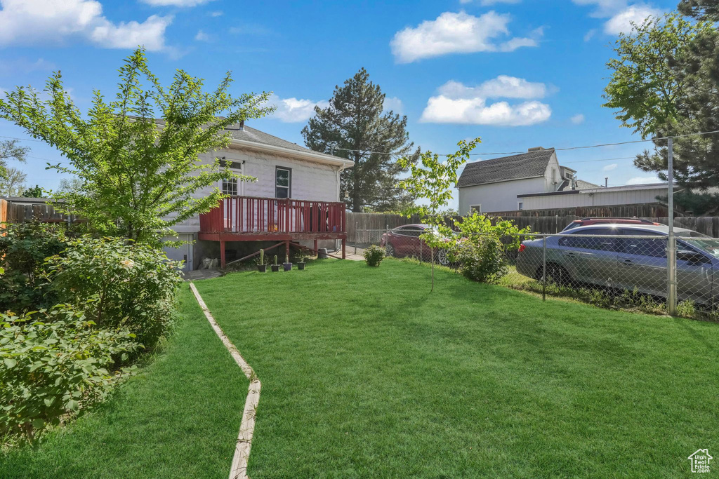 View of yard with a deck