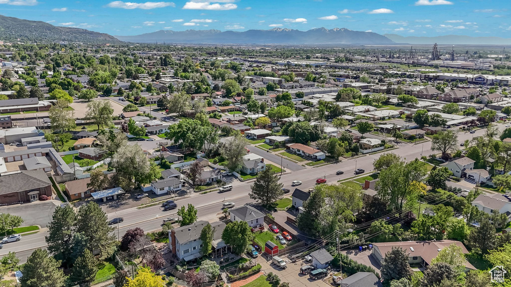 Aerial perspective of suburban area featuring a mountainous background