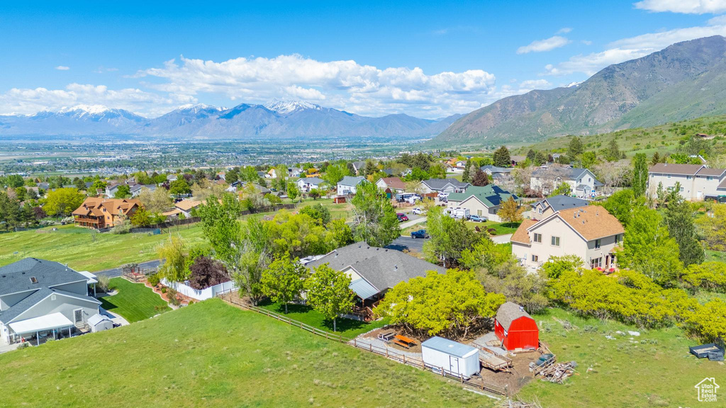 Aerial view of residential area featuring a mountain backdrop