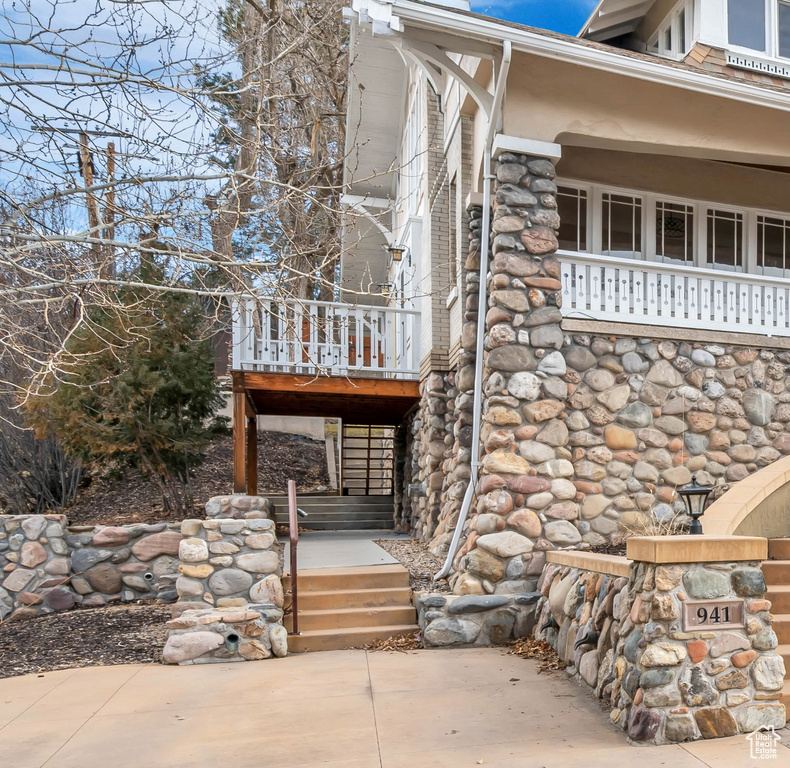 View of property exterior featuring stone siding