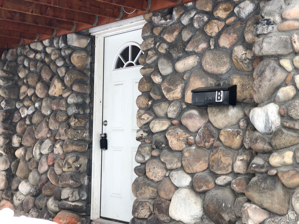 View of exterior entry with stone siding