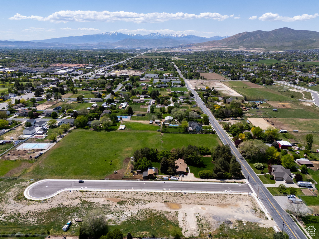Aerial perspective of suburban area with a mountain backdrop