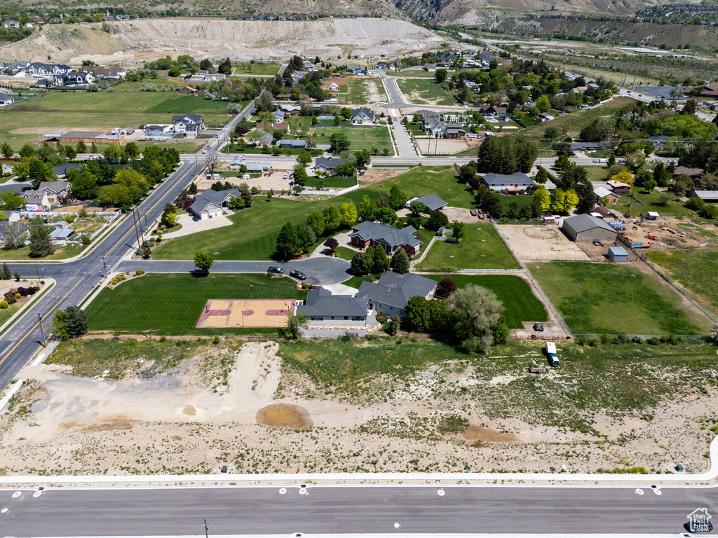 Aerial view of property\'s location featuring nearby suburban area