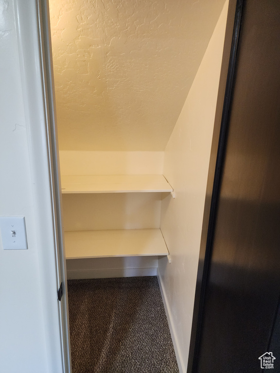 Detailed view of carpet floors and baseboards