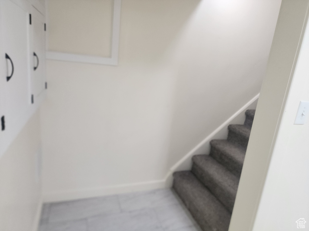 Stairway featuring baseboards