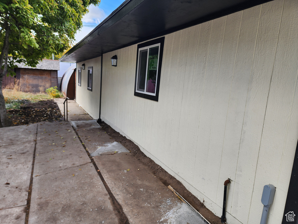 View of side of property featuring a patio