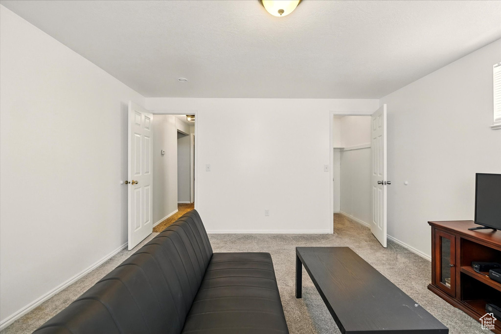 Living room with carpet and baseboards