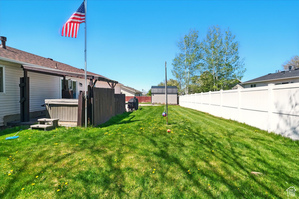View of yard with a hot tub
