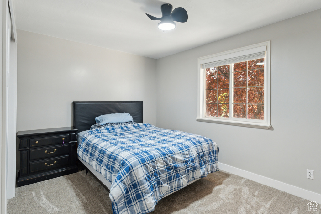 Carpeted bedroom with baseboards
