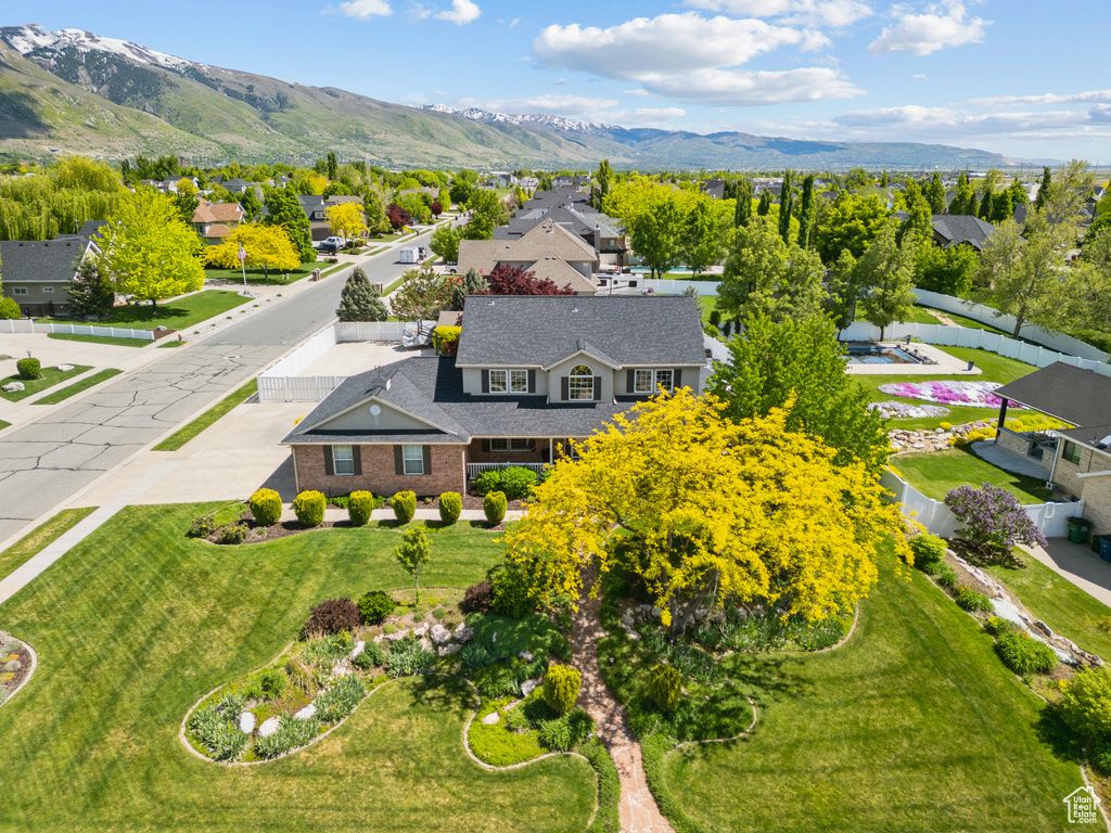 Aerial perspective of suburban area with a mountain backdrop