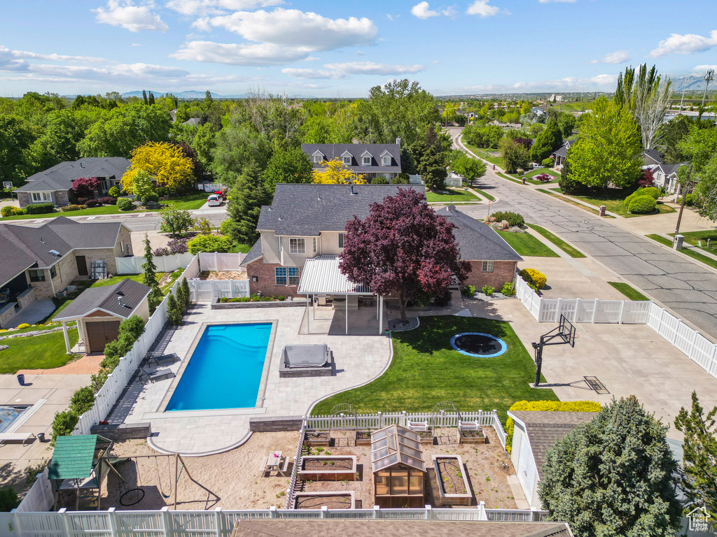 View of swimming pool with a fenced backyard and a residential view
