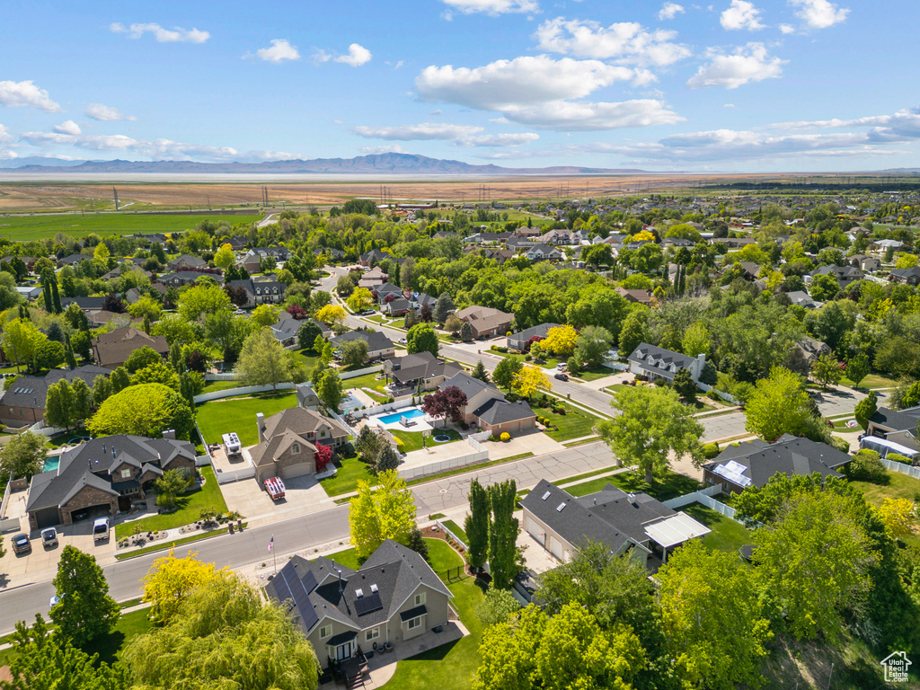 Aerial perspective of suburban area with a mountain backdrop