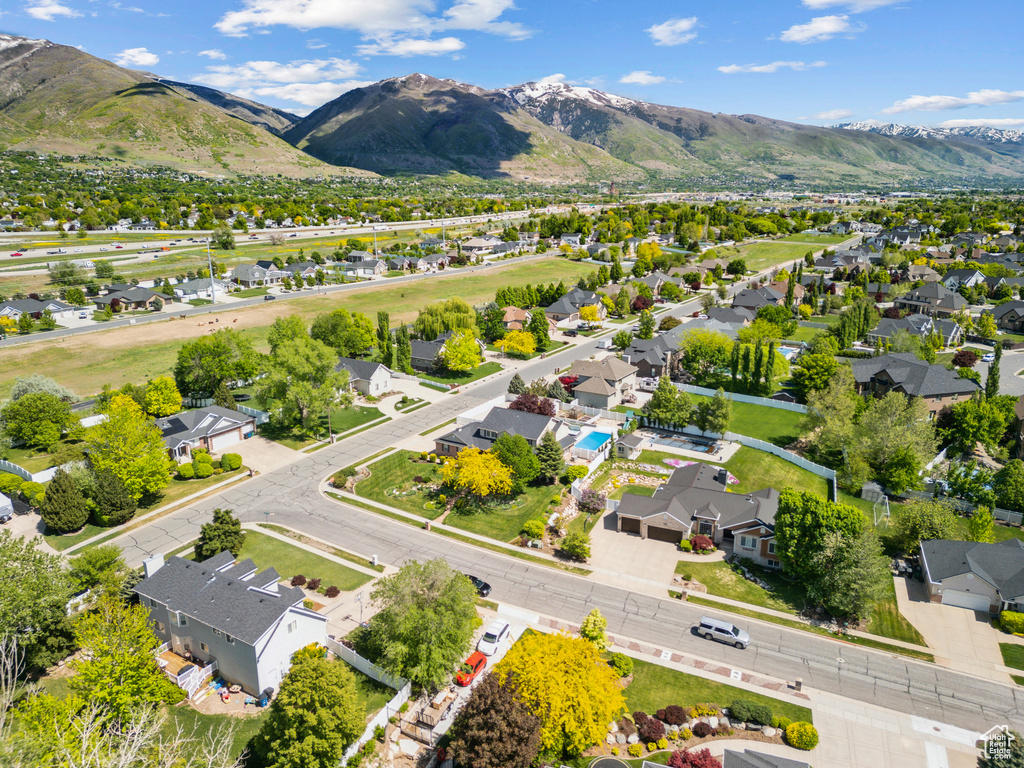 Aerial view of residential area featuring a mountainous background
