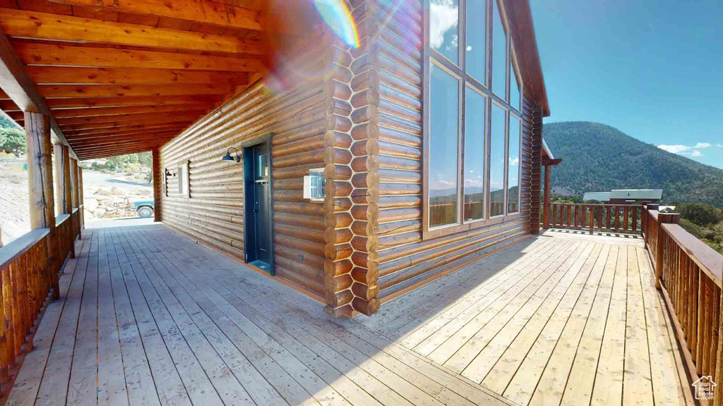 Wooden deck featuring a mountain view