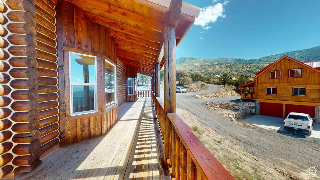 View of side of home featuring a mountain view and log siding