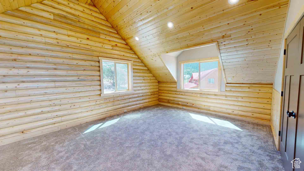 Additional living space featuring rustic walls, wooden ceiling, vaulted ceiling, carpet, and recessed lighting