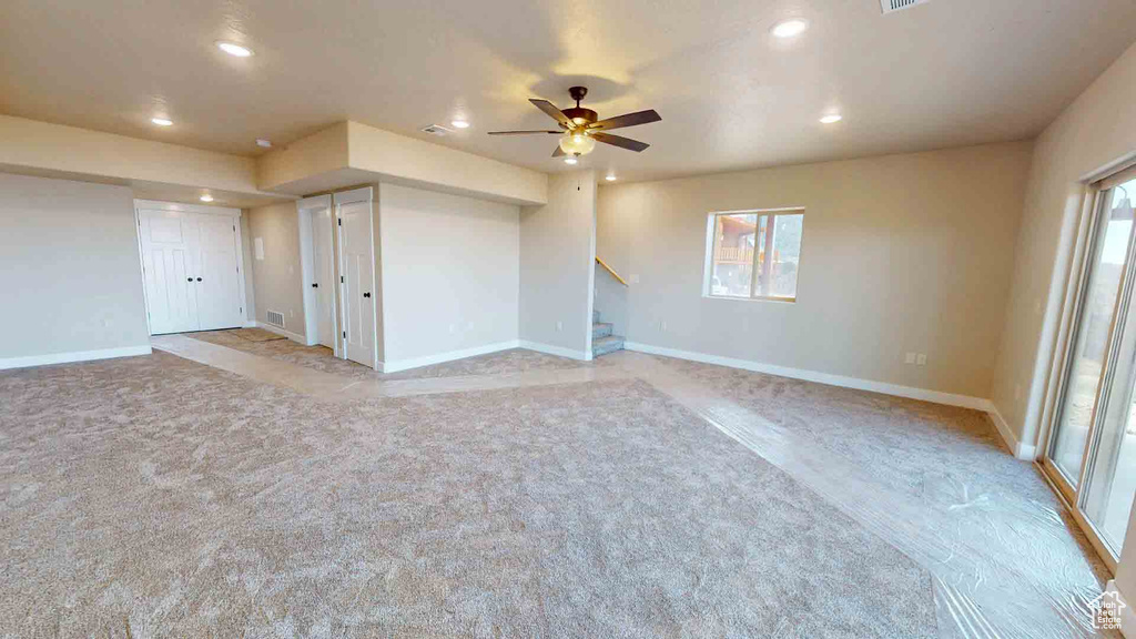 Spare room with recessed lighting, stairs, a ceiling fan, and baseboards