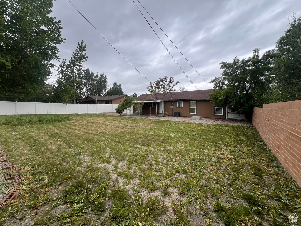 View of yard featuring central AC