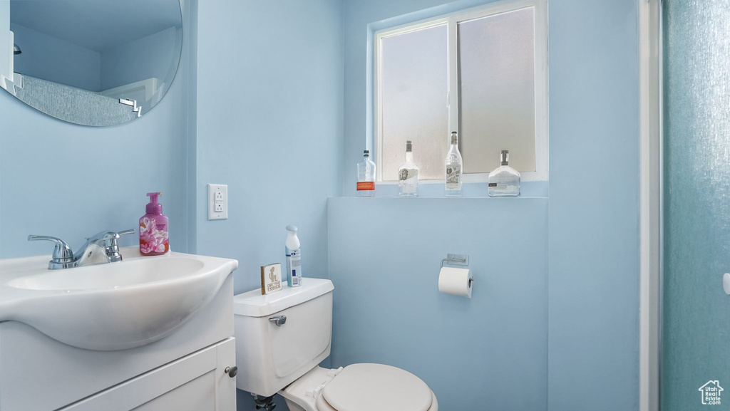 Bathroom with toilet and vanity