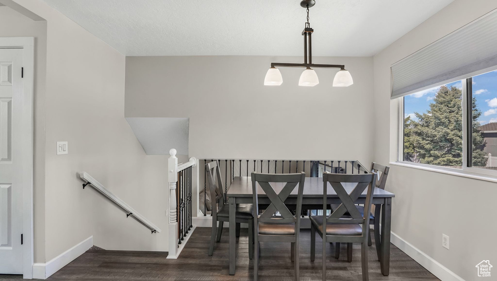 Dining area with wood finished floors and baseboards