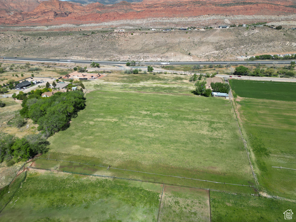 Aerial view of property's location with rural landscape and mountains