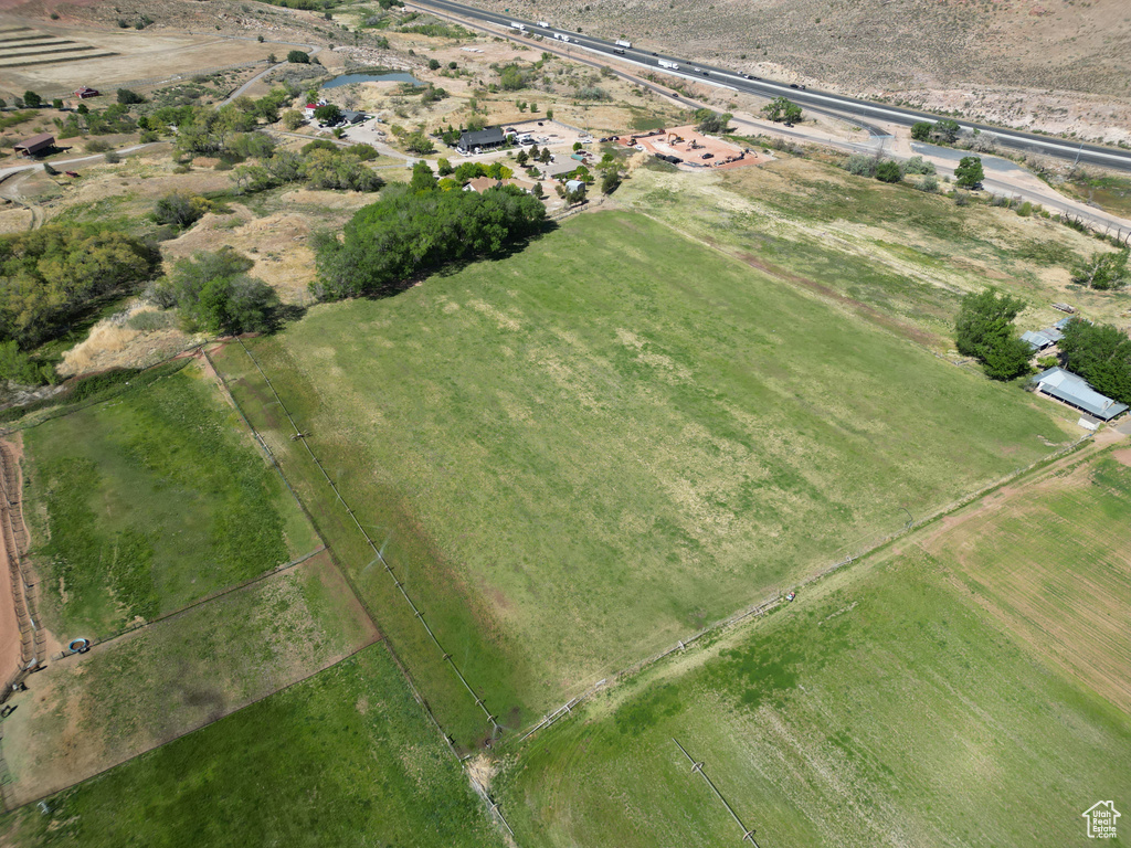 Aerial view of property and surrounding area featuring rural landscape