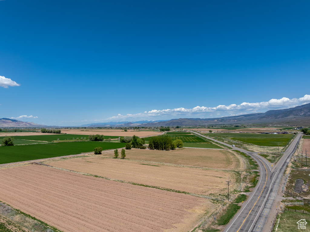 View of home\'s community featuring a view of countryside, a mountain view, and agricultural plots